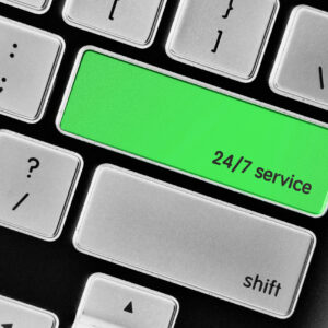 The computer keyboard button written word 24/7 service